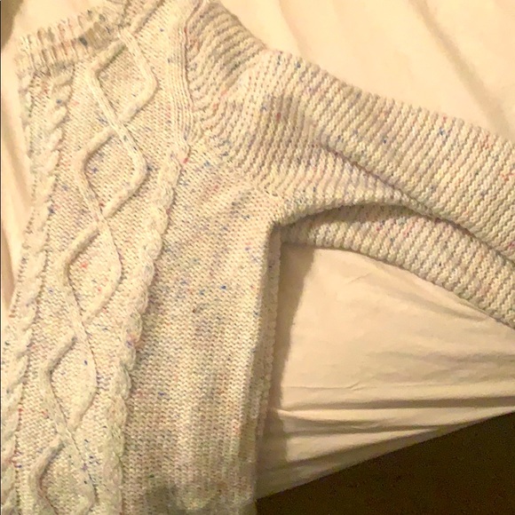 A cream white sweater. - Picture 2 of 3